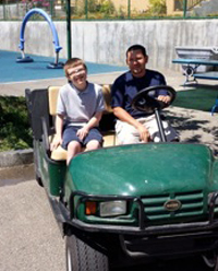 boys in golf cart, image